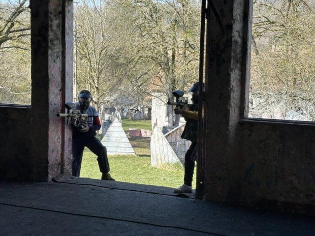 Players in a tactical paintball setting